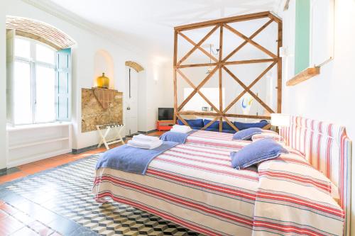 Ένα ή περισσότερα κρεβάτια σε δωμάτιο στο Império House