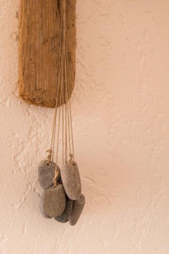a bunch of rocks hanging on a wall at Utopia in Aljezur