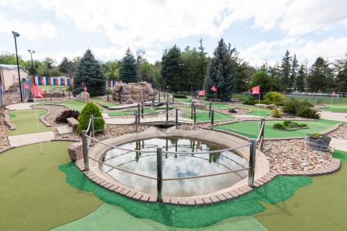 a golf course with a pond in a park at Hills Inn in Hot Springs
