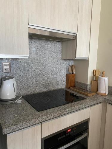 a kitchen with a stove and a counter top at Vista Nevada in Nevados de Chillan