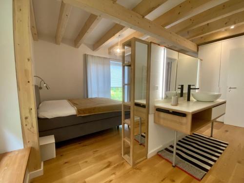 a bathroom with a bed and a sink in a room at Holiday home in Zingst with swimming pool in Zingst