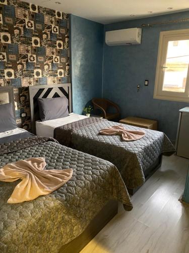 Postel nebo postele na pokoji v ubytování Sunset Hostel