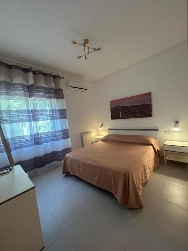 Ένα ή περισσότερα κρεβάτια σε δωμάτιο στο Villa Giacrì