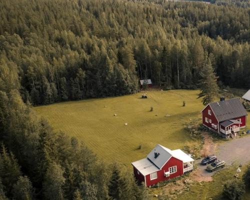 an aerial view of a farm with a red barn at Nordic Catch Cabin in Överkalix