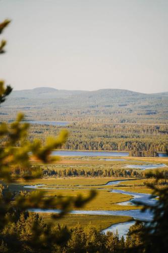 a view of a river from a tree at Nordic Catch Cabin in Överkalix