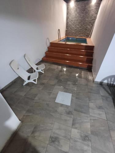 a room with a hot tub in a stair case at Casa dos Netos in Reguengos de Monsaraz