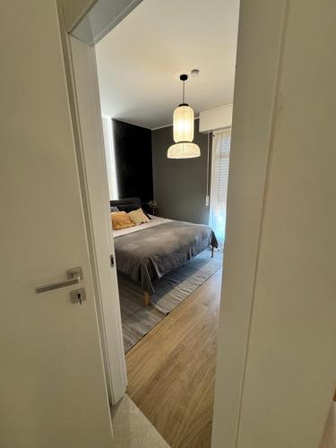 a bedroom with a bed and a large window at Appartamenti a Carpi in Carpi