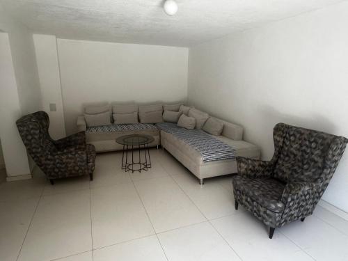 a living room with a couch and two chairs at Holiday home with private pool ''Lux Banja Luka'' in Banja Luka