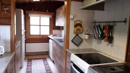 a kitchen with a sink and a stove top oven at Herralan huvila lähellä PowerParkia Kauhava in Kauhava