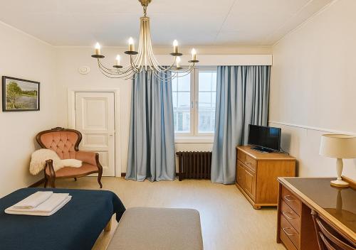 TV a/nebo společenská místnost v ubytování Senate Hotel