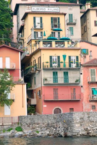 a group of buildings next to a body of water at Albergo Milano in Varenna