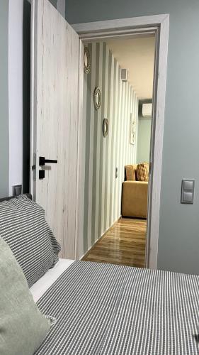 a bedroom with a bed and a couch at Central Haven in Volos