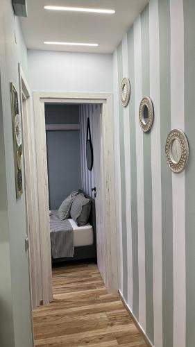 a hallway leading to a bedroom with a bed at Central Haven in Volos