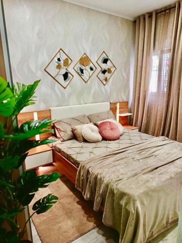 a bedroom with a bed with pillows on it at BOUTIQUE LUXURY City Center in Alicante
