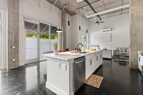 a kitchen with a sink and a counter top at Luxury Loft-Coastal Vibe in Dallas