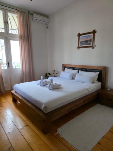 a bedroom with a bed with two towels on it at Devedzic in Vrnjačka Banja