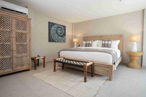 a bedroom with a large bed and a tv at The Providence Hotel Boutique in San Andrés