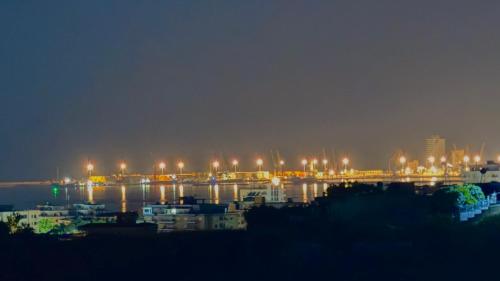 a harbor at night with boats in the water at Sunset Hill Villa in Durrës