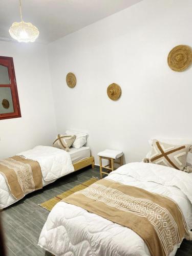 Postel nebo postele na pokoji v ubytování Agadir Tighanimine maison avec piscine dans une ferme