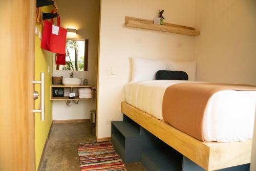 Postel nebo postele na pokoji v ubytování Hotel con Corazon Monteverde