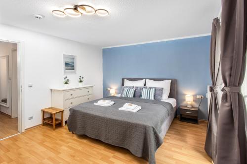 Ένα ή περισσότερα κρεβάτια σε δωμάτιο στο Deluxe-Apartment I Balkon I Tiefgarage I WLAN