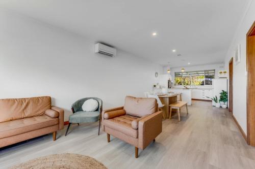 a living room with two chairs and a table at The sweet and spicy retreat in Mount Gambier