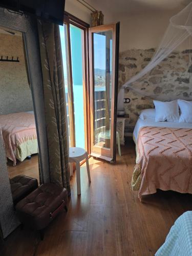 Postel nebo postele na pokoji v ubytování Hostal La Garita