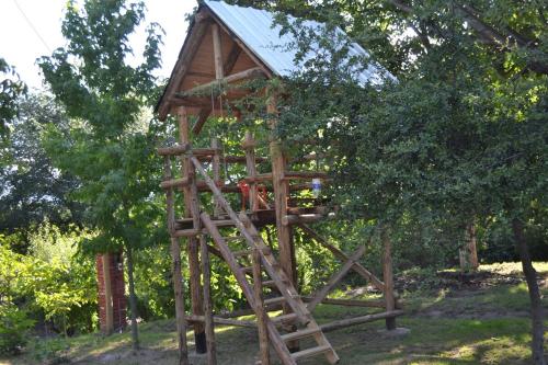 a tree house in the middle of a forest at Cabañas La Mercedes-Cabaña 1 in Tupungato