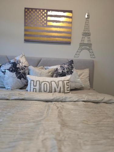 a bed with an american flag and the words home at Houston Amazing Lux Livin near IAH in Atascocita