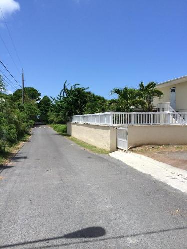 an empty road in front of a house at Georges Royal Inn in Frederiksted