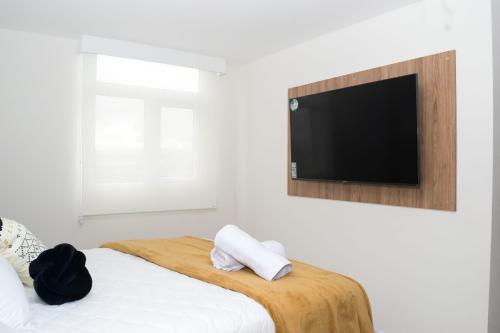 TV a/nebo společenská místnost v ubytování Encanto 11 - Deluxe Apartment en zona 11 Wifi-parqueo-piscina