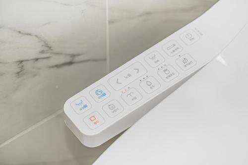 a remote control sitting on top of a counter at Jeju The Terrace View in Jeju