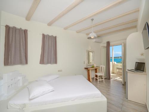 Postel nebo postele na pokoji v ubytování Angel Suites