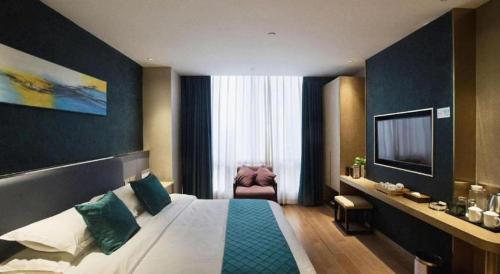 Letto o letti in una camera di Southeast Peninsula Hotel Quanzhou