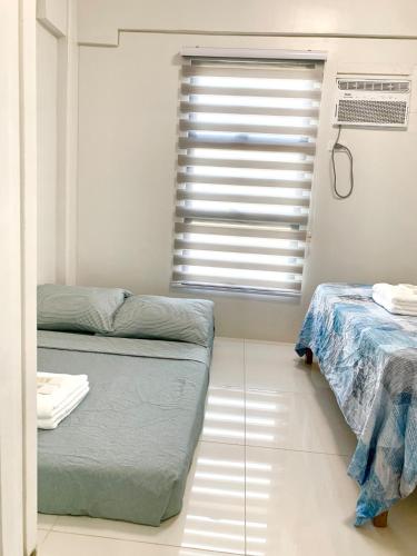 Postel nebo postele na pokoji v ubytování Panglao-Island Condo Unit Rental 1