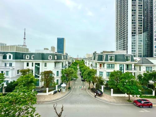a street in a city with tall buildings at Great Quality, Convenient To Airport Stu Apt In City Centre in Hanoi