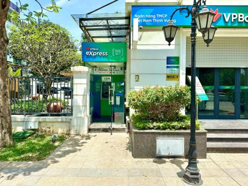 a street light in front of a gas station at Great Quality, Convenient To Airport Stu Apt In City Centre in Hanoi