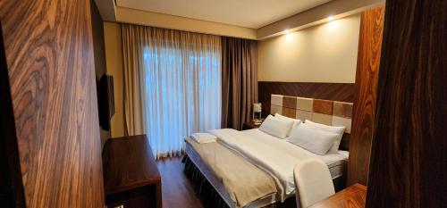 Ένα ή περισσότερα κρεβάτια σε δωμάτιο στο Dreamland Oasis Аpart