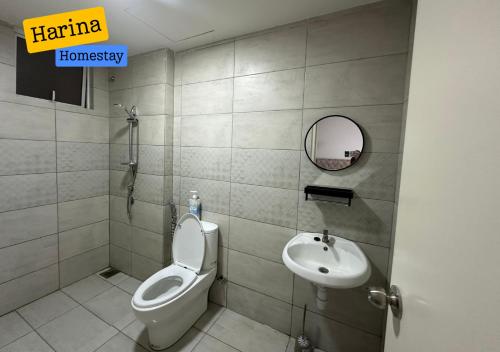 a bathroom with a toilet and a sink at Harina Homestay At Sireh Residence near AEON MALL KOTA BHARU in Kota Bharu