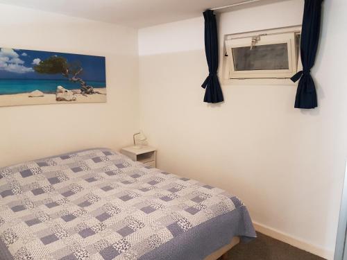 Ένα ή περισσότερα κρεβάτια σε δωμάτιο στο Appartement in Zandvoort