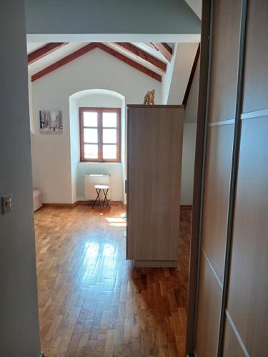 an empty room with a table and a window at Gospar Apartments in Kotor