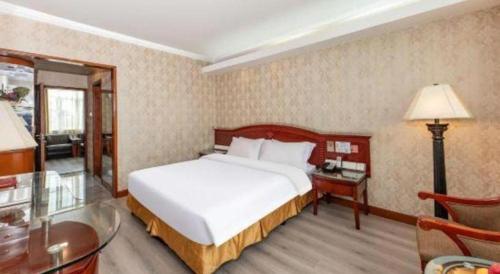 Katil atau katil-katil dalam bilik di Zhenxing Hotel