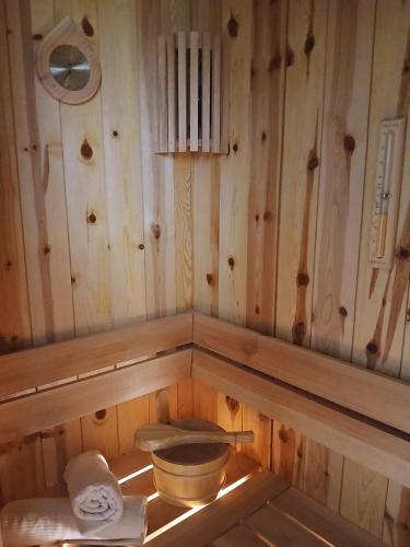 a bathroom with a toilet in a wooden wall at House therapy in Sremčica