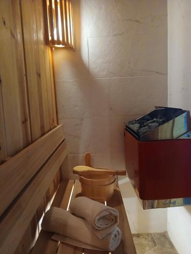 a small bathroom with a toilet and a tub at House therapy in Sremčica