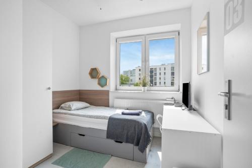 Katil atau katil-katil dalam bilik di Sport Rooms I Chodakowska Warszawa