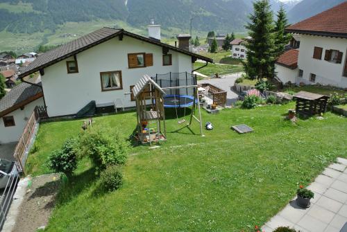 an aerial view of a yard with a playground at Ustria / Pensiun Trutg in Vella