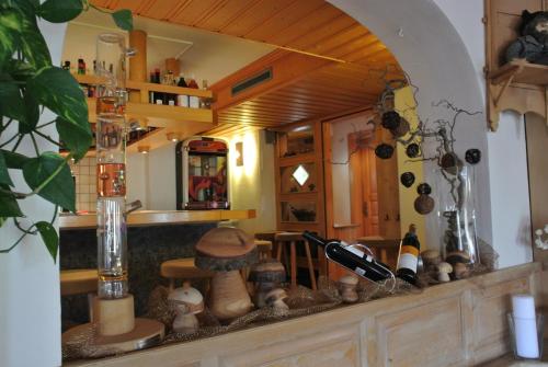 a kitchen with a counter top with a mirror at Ustria / Pensiun Trutg in Vella