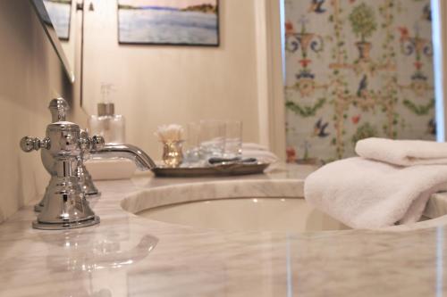 a bathroom with a sink and a shower at 34 State "Historic Luxury Suites" Skaneateles in Skaneateles