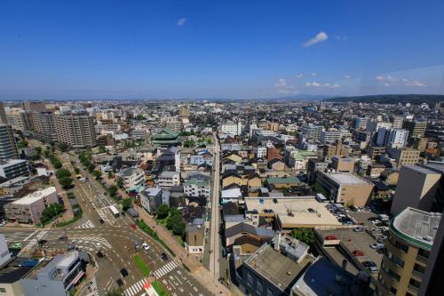 an aerial view of a city with buildings at ANA Holiday Inn Kanazawa Sky by IHG in Kanazawa