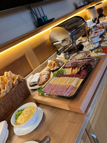 a kitchen counter with a bunch of food on it at Penzión Patrik in Ždiar